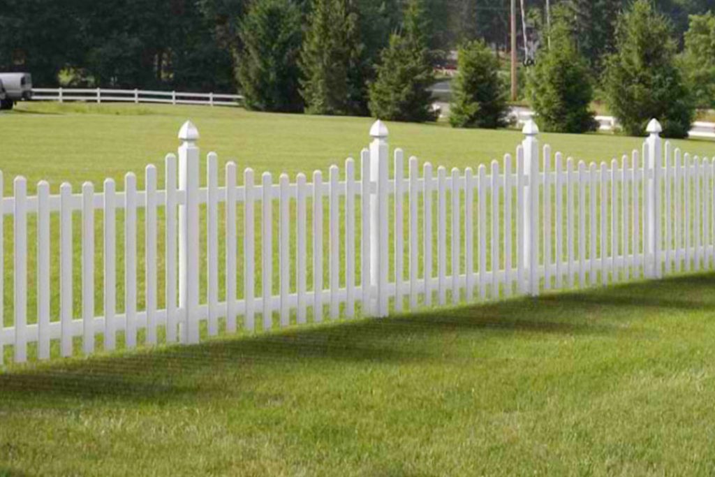 white vinyl scalloped picket fence