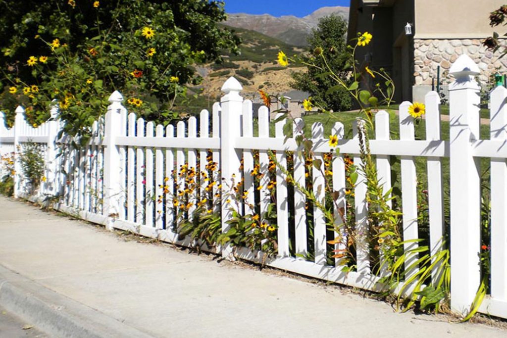 white vinyl scalloped picket fence